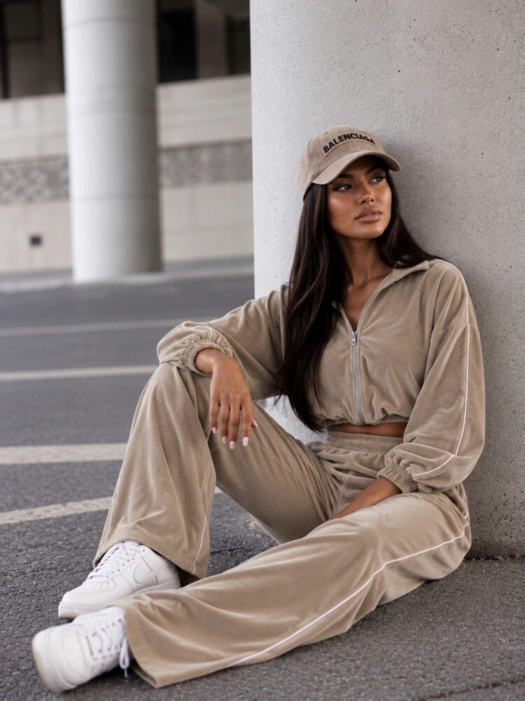 A velour set comprising trousers and a hooded top